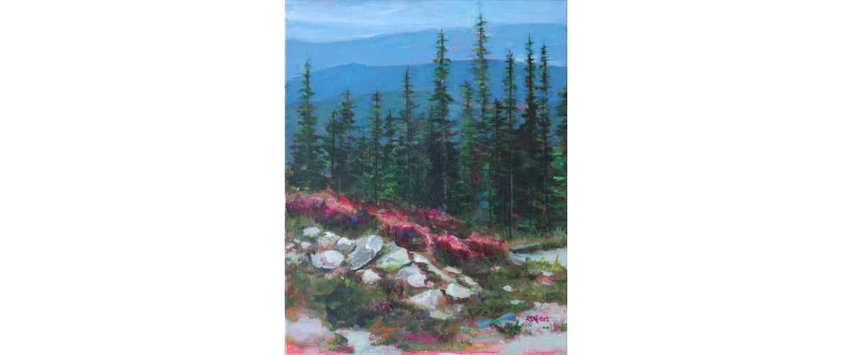 Perspective of mountains with a stand of tall pine trees in the middle. The foreground has pink flowers and rocks mixed with a bit of greenery.